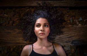 woman laying on wood floor