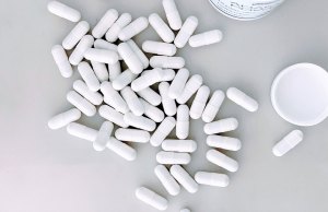 white pills on white background