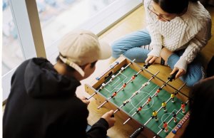 two people playing foosball