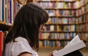 woman reading in library