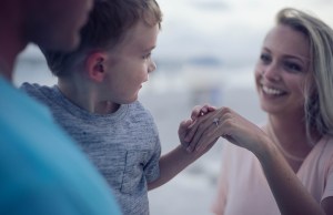 Child holding adult hand