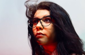 woman with brown hair and glasses