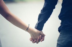 two people holding hands