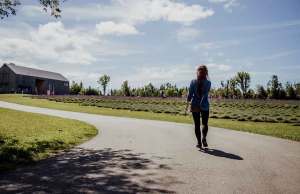 woman walking outside by farm