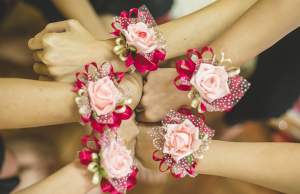 women wearing pink corsages