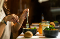 woman-eating-tasty-chicken-salad-with-dessert