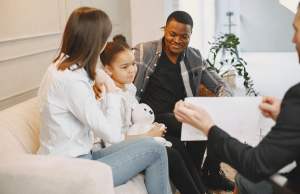 Family sitting on the couch in therapy