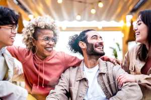 Multicultural cool people having fun at an outdoor patio