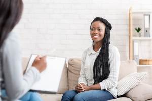 Woman sitting on a couch in therapy