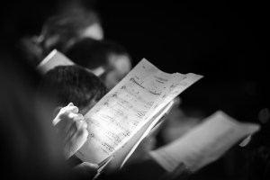 Choir holding pages of music